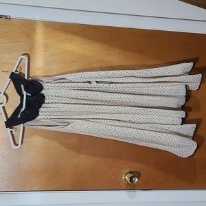 Swing dress cream and black polka dots dress.